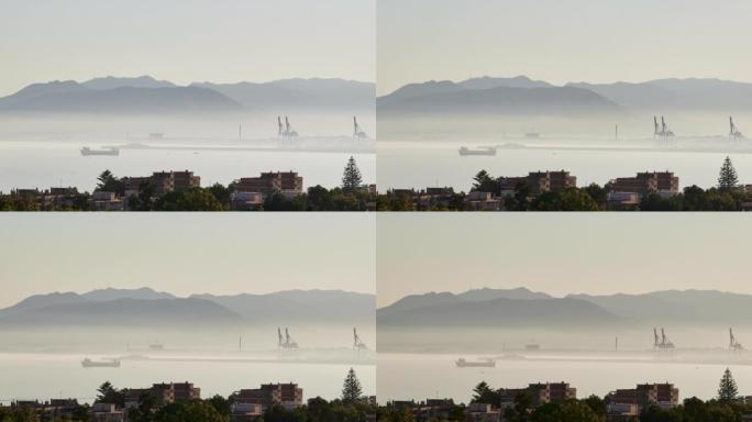 马拉加港口日落时的延时，潮湿和小船航行造成的薄雾