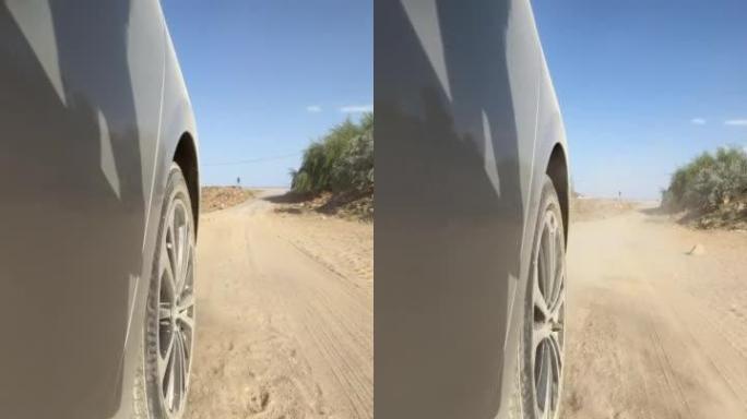 Tire of a car driving on gravel road