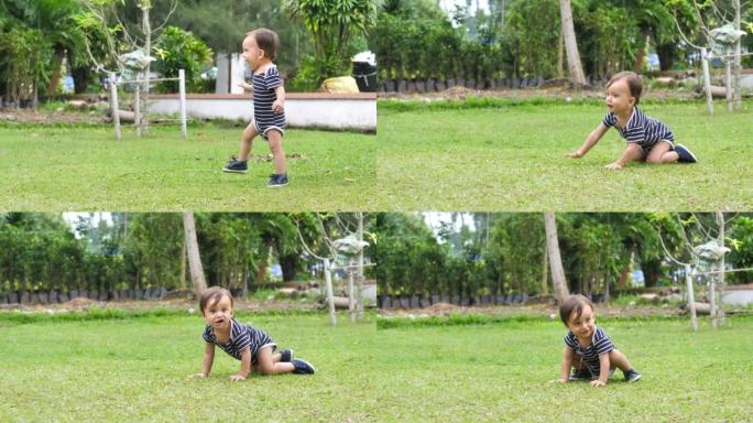 可爱的婴儿学习走路，在公园的草坪上迈出第一步。