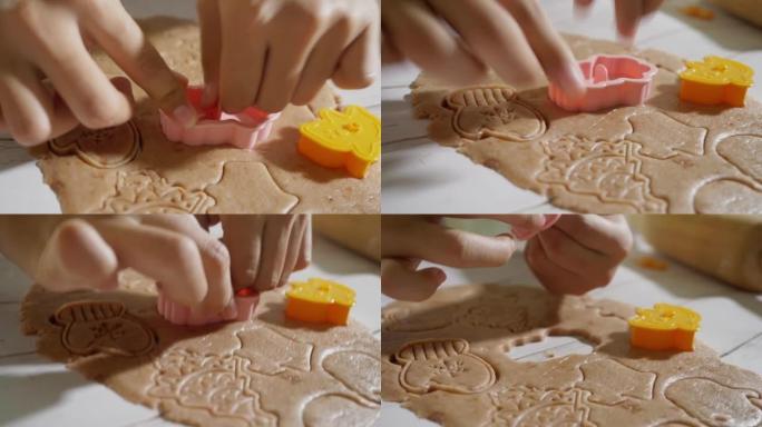 儿童用饼干切割器成型自制饼干庆祝圣诞节，生活方式概念