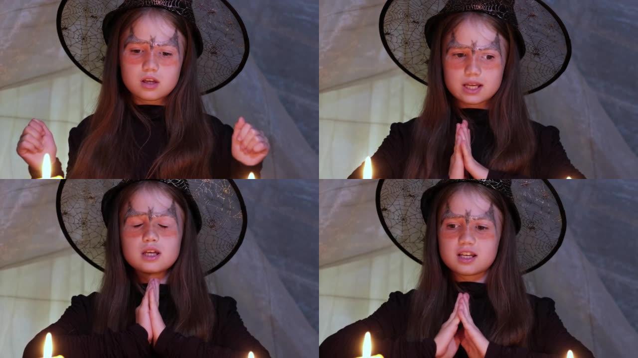 小女巫在烛光下在万圣节之夜读咒语