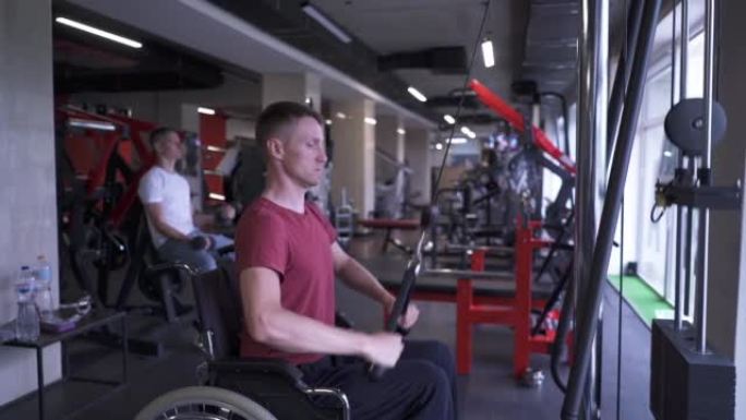 Man in a wheelchair working out at the gym