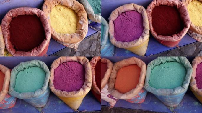 摩洛哥舍夫沙万 (Chaouen) 麦地那的彩色染料颜料袋。摩洛哥受欢迎的旅游目的地。4k镜头。