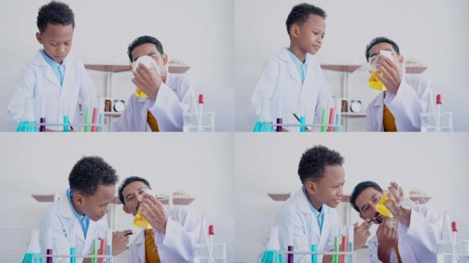 4K，大胡子的亚洲老师正在教混血男孩，当将干冰倒入科学实验室并在小学科学实验室形成蒸汽时，在科学实验