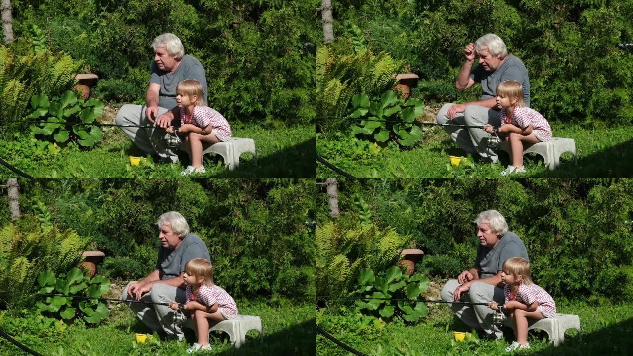 祖父和孙子在夏天日落时钓鱼。一起钓鱼。满头白发的小男孩和老人正拿着鱼竿抓鱼。
