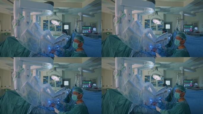 外科医生在手术过程中看着监视器。监视器显示外科医生在患病患者的腹腔内的所有动作。在手术过程中，患者的