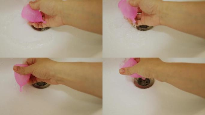 浴室流水下洗手女性月经杯，清洁卫生