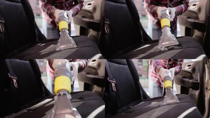 对汽车座椅进行深度清洗，去除污渍。吸尘器的喷嘴中冒泡的脏水特写。慢动作视频。