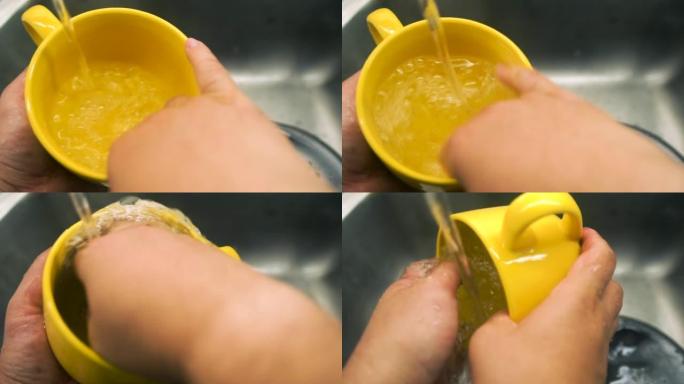 男人的洗手黄色杯子。