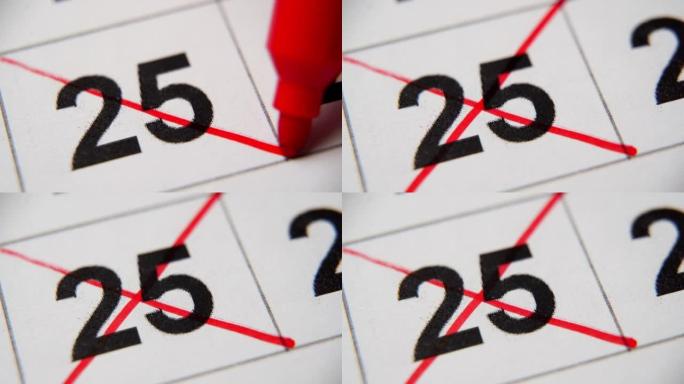 日历中的第25个数字在白纸上的宏中用红叉划掉。计划、笔记、会议日历。商业日历。日历中注释的标记。