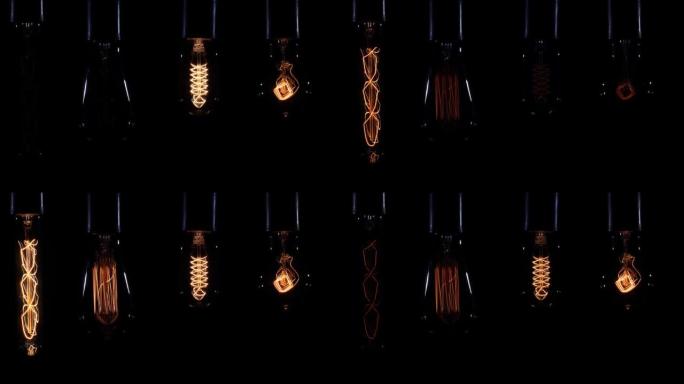 一套几个脉动白炽灯作为视频编辑的背景。带钨螺旋吊灯的灯丝灯在黑色背景下点亮并熄灭。