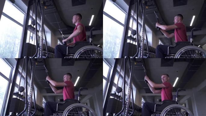 坐在轮椅上的男子在健身房锻炼