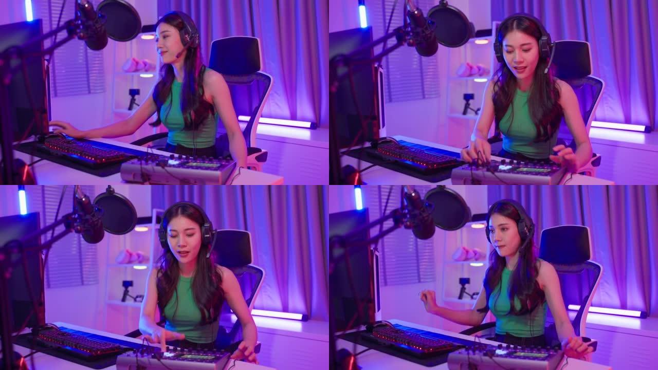 Asian attractive audio DJ woman speaks into microp