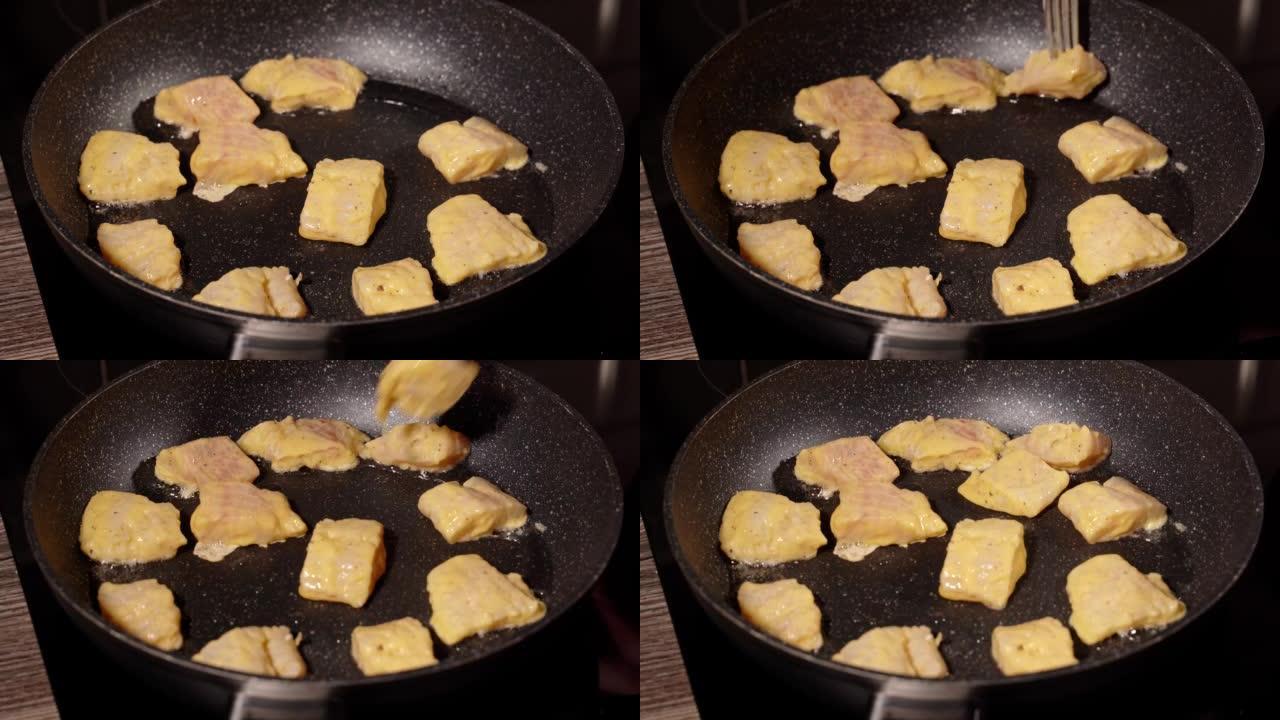 一步一步地用面糊自制炸鱼。步骤5将蘸有面糊的鱼片在加热的煎锅中用油油炸