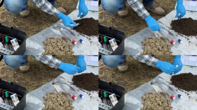 专家在室外采集土壤样本进行实验室分析