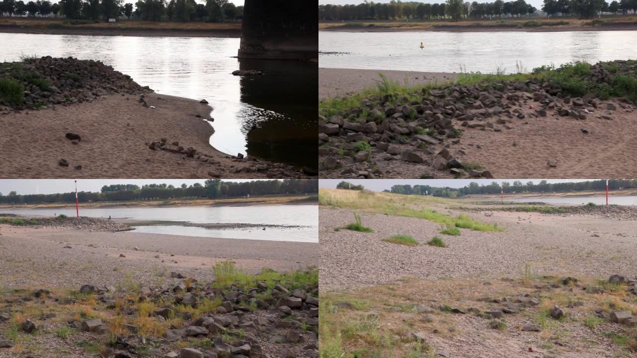 莱茵杜塞尔多夫河的极端低水位线在没有降雨的极端干旱中导致河床干燥，低潮显示全球变暖和气候变化，河岸缺