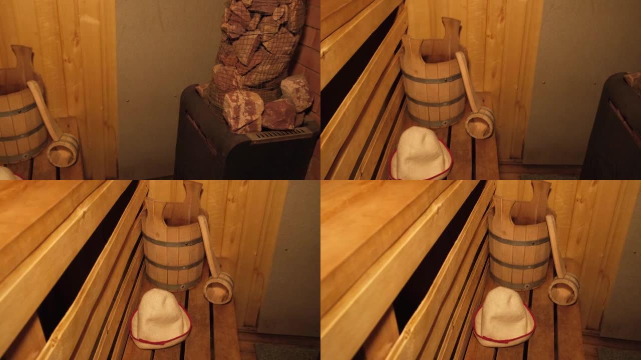 传统的老俄罗斯浴室水疗概念。内部细节芬兰桑拿蒸汽房与传统桑拿配件设置勺毡。放松乡村沐浴概念