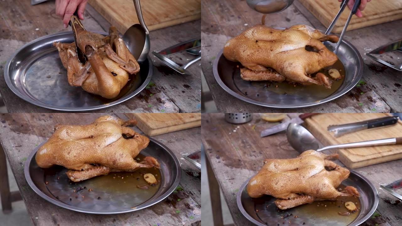 不锈钢托盘上的炖鸭，传统的炖鸭