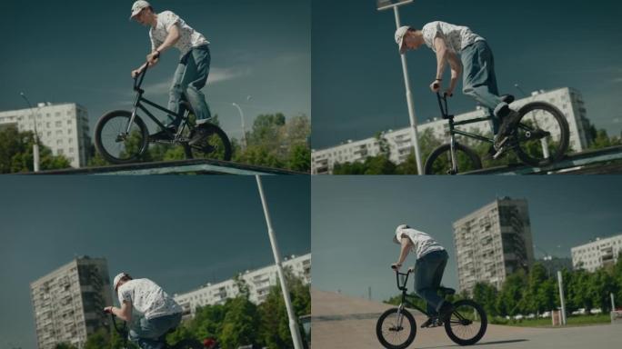 滑板场的城市极限。一个骑自行车的年轻人表演技巧和跳跃。极端