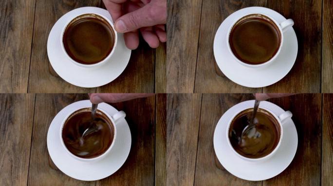 Teaspoon stirring black coffee espresso with thick