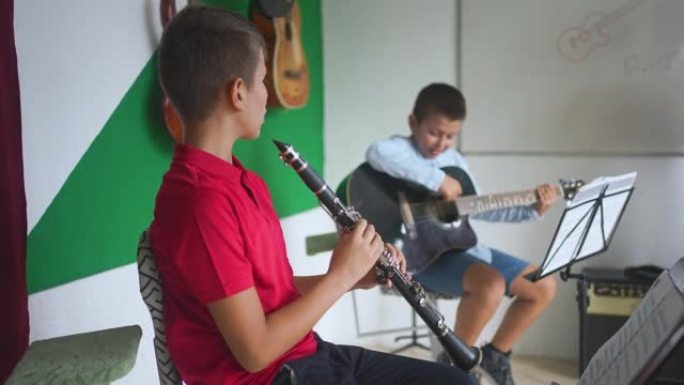 Happy Music Students Enjoying Playing Together On 