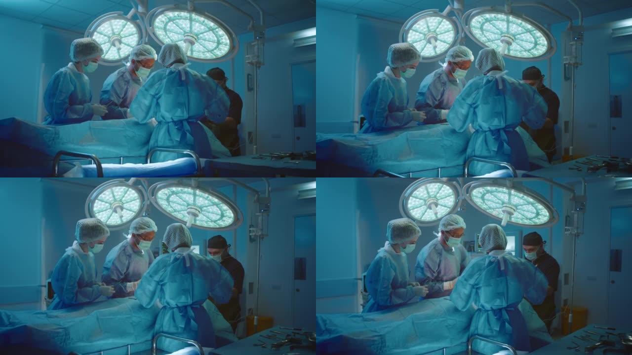 手术室里的四个人正在讨论并为患者进行胃部手术