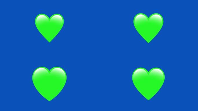 4k无缝循环绿色心形，完全旋转隔离在蓝屏背景。社交媒体的心。情人节和爱情的概念。