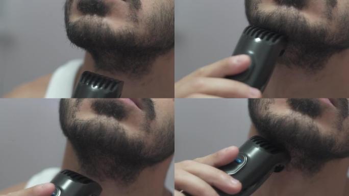 男人用剃刀割胡子