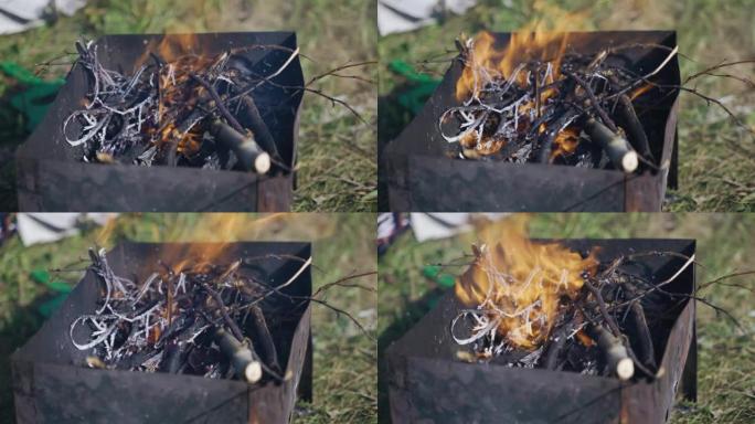 树的树枝在烤架中燃烧，形成烧烤煤。以慢动作射击kurpno