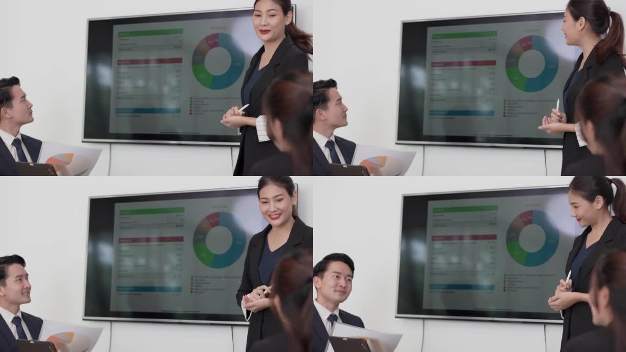 The business woman presenting to people staff and 