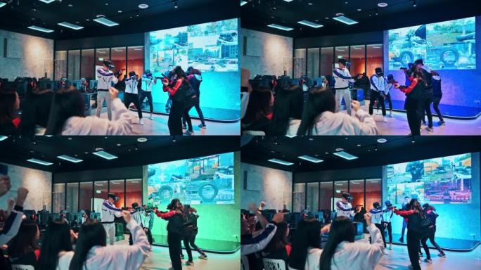 2支亚洲电子竞技团队在舞台上进行VR射击视频游戏的比赛，在总决赛中相互竞争