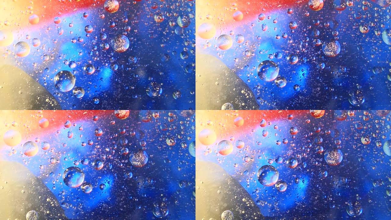 水上浮油气泡，蓝色，金色和红色背景。