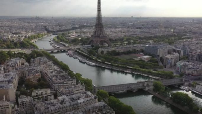 阳光明媚的云日巴黎市中心著名的塔广场河畔湾空中俯拍全景4k法国