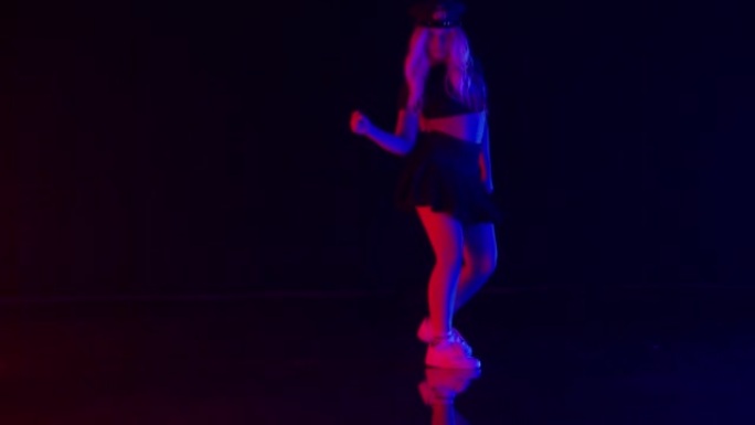 Sexy Young Woman in Policeman Hat Dances in Colorf
