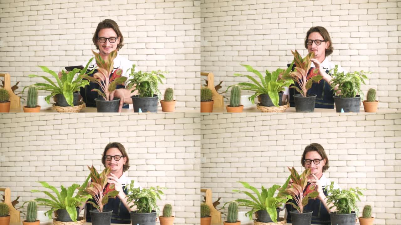 植物店老板为社交媒体捕捉美丽的植物，在线销售