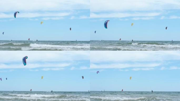 风筝在蓝天下冲浪。