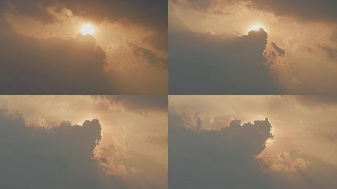 傍晚时分美丽的日落，起伏的云层覆盖阳光，4k延时视频，美丽的天空与云彩背景，b滚动镜头。