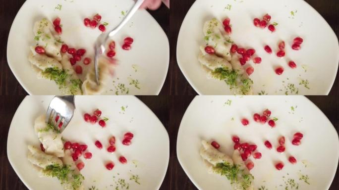 人的观点。第一种观点，吃格鲁吉亚吉尔扎饺子。饺子用石榴籽装饰。