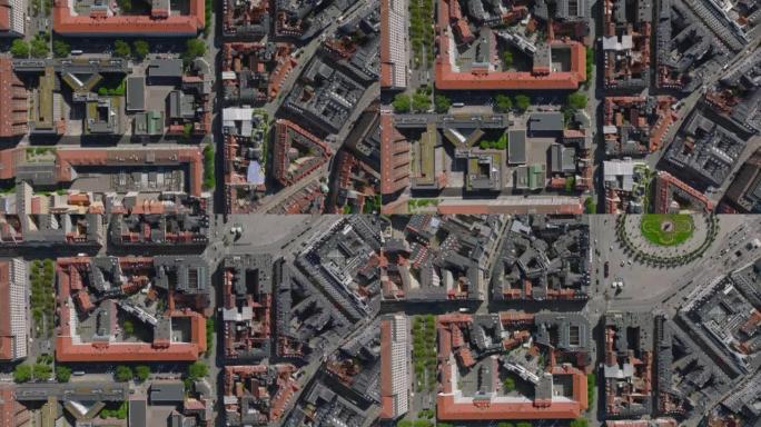城市城镇发展的自上而下的平移视图。飞过联排别墅、街道和广场的街区。丹麦哥本哈根