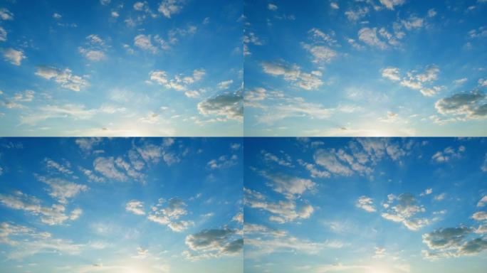 美丽的蓝天，云彩背景。天然的夕阳白云和黄云漂浮在蓝天上。时间流逝。