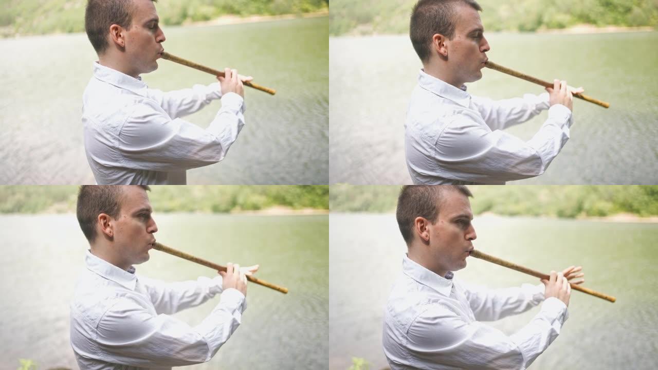 冷静的男音乐家在湖边演奏卡瓦尔木管乐器