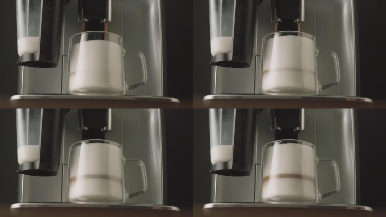 将新鲜酿造的卡布奇诺咖啡从咖啡机中倒入玻璃杯中。