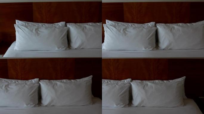 一张完美的大号床，有干净的白色枕头和床单
