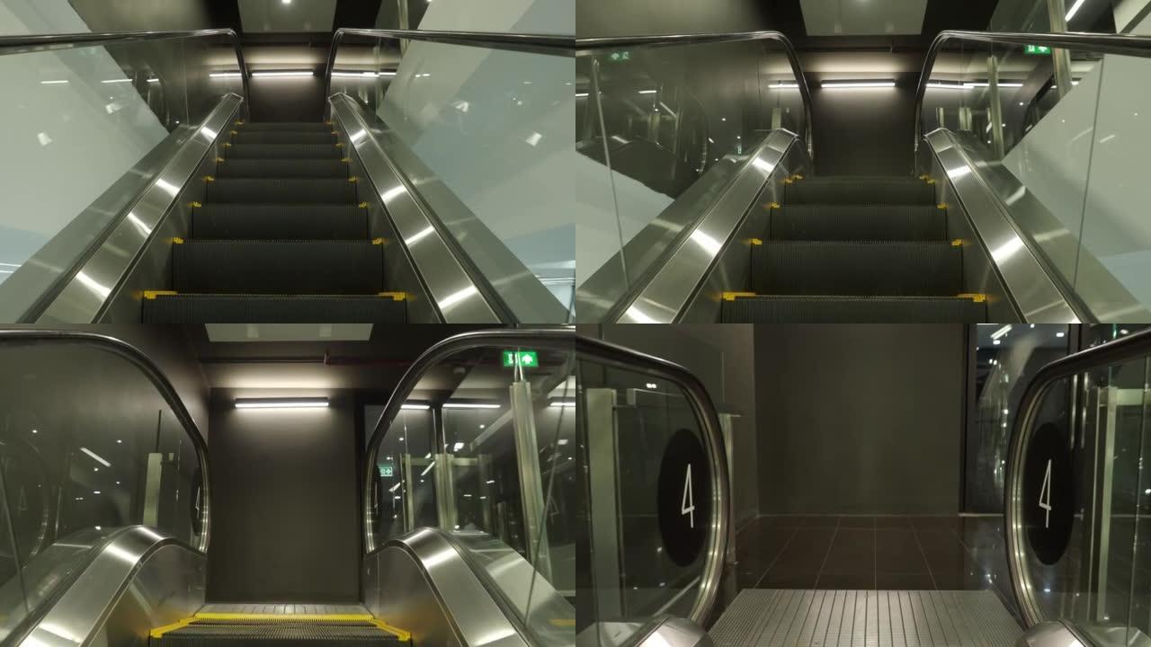 使用自动扶梯。视点或视点视频片段。空的移动楼梯上下移动的特写镜头。现代自动扶梯楼梯在室内上下移动。带