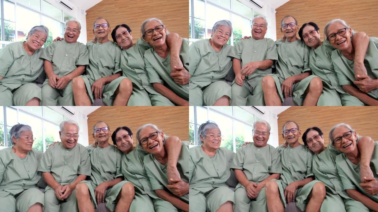 老年人微笑着对着镜头拍照，老年人在养老院或养老院一起拍照，老年人肖像