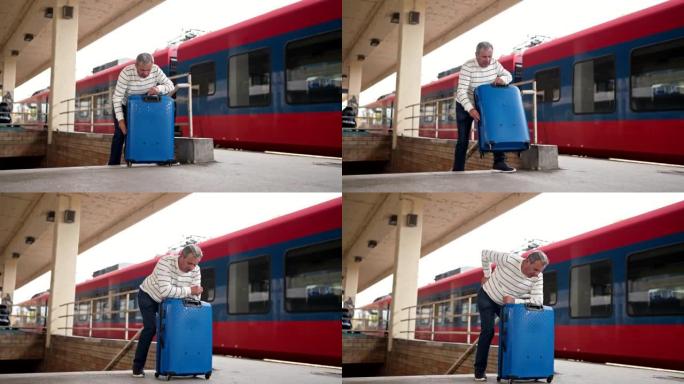 腰酸背痛的老人在火车站提着沉重的行李箱上楼梯