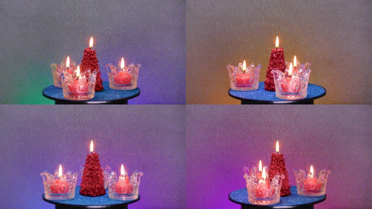 在彩色背景上，新年蜡烛在看台上旋转
