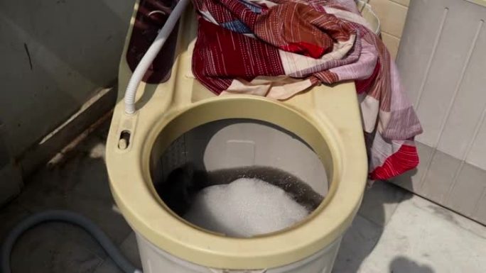 Washing machine spinning water and bubble