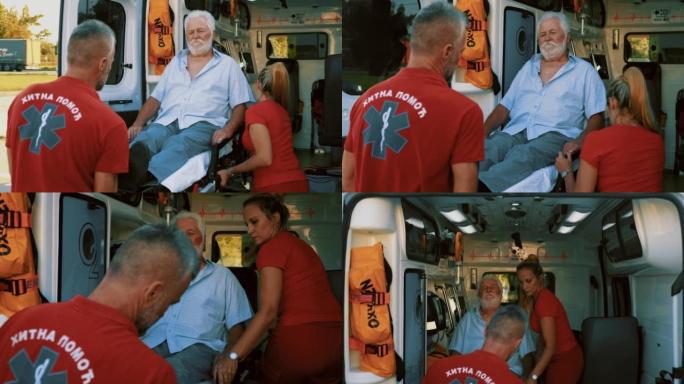 一个悲伤的老人在救护车担架上被送往医院的慢动作镜头。把病人装上救护车