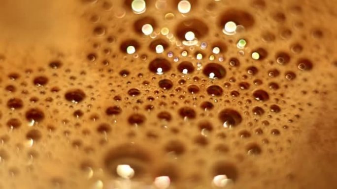 Bubbles with foam with bokeh effect on surface of 